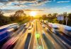 heavy traffic moving at speed on UK motorway in England at sunset