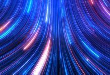 Abstract colorful glow light trail with blue red particles background.