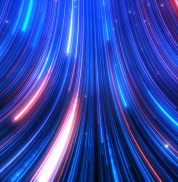 Abstract colorful glow light trail with blue red particles background.