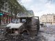 Burned car in the center of city after unrest