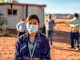 Navajo Family Social Distancing with Covid-19 Masks outside their home in Monument Valley Arizonaa