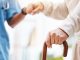 Walking stick, nurse and hands helping patient, support and therapy of disability, parkinson or arthritis. Cane, disabled old man and physiotherapy in nursing home, elderly healthcare or osteoporosis