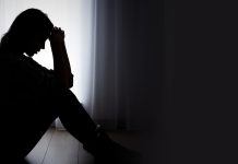 Depressed woman. Sadness and headache concept