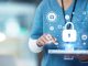Medical cybersecurity, tablet and hands of doctor, surgeon or nurse with virtual hologram for database lock. Mockup hospital, life insurance and woman with digital archive biometric for info safety