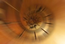 Abstract background from nature using motion, radial or zoom blur - metphor for vertigo, deep space, dizzy, unstable mental health illness, constrained, spinning wheel
