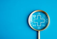 Healthcare service, hospital website online search, wellness plan and insurance concept. Health, care and medical element icon symbols in magnifying glass lens on blue background with copy space.