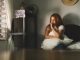 Young Latin American woman sitting in her room biting her fingers. anxiety concept