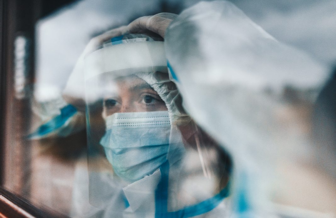 virologist at the window looking away