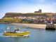 Whitby skyline and river Esk and boats UK in Scarborough Borough Council of England United