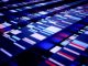 Abstract high-tech background with glowing lights in a row. Next-generation sequencing concept.