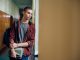 Sad teenage boy thinking of something while standing in hallway at high school. Copy space. article covering: Right-wing ethno-nationalists and jihadi Salafists