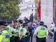 Happy laughing group of metropolitan police officers patrols the crowds of tourists in Whitehall in Westminster, London, UK