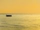 fishermen come home at the end of the afternoon on the beach Padang