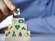 Medical health insurance concept. Men's hand arranging wood blocks with healthcare medicine icons