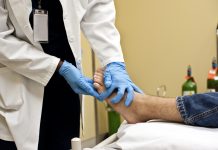 Checking the patient's foot