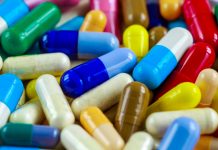 Drug prescription for treatment medication. Pharmaceutical medicament, cure in container for health. Pharmacy theme, capsule pills with medicine antibiotic in packages.