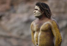 Cairns, Queensland, Australia - August 28th, 2005: An Aboriginal Man with body paint, with thoughtful stare in Cairns, Queensland in Australia on 28th August 2005