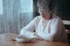 Sad, senior woman having lack of appetite - eating disorders