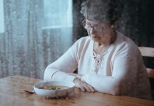 Sad, senior woman having lack of appetite - eating disorders