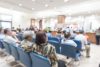 Blur medical background clinic service counter lobby with patient paying bill at cashier desk in hospital