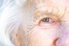 Extreme Close-Up Shot from above of a Beautiful, Sharp, Intelligent Elderly Senior Caucasian Woman's Eyes and Face in the Summer Outdoors, Understanding age-related macular degeneration and emerging treatments