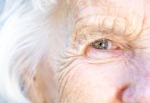 Extreme Close-Up Shot from above of a Beautiful, Sharp, Intelligent Elderly Senior Caucasian Woman's Eyes and Face in the Summer Outdoors, Understanding age-related macular degeneration and emerging treatments