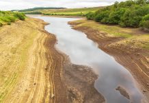 Leighton Reservoir in Nidderdale, North Yorkshire, UK, with very low water levels following a prolonged heatwave and no rainfall.
