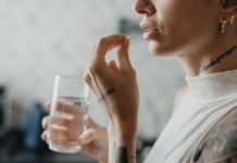 Woman medicating himself at home medicine