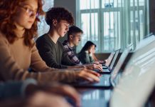 High school students e-learning over computers in the classroom.