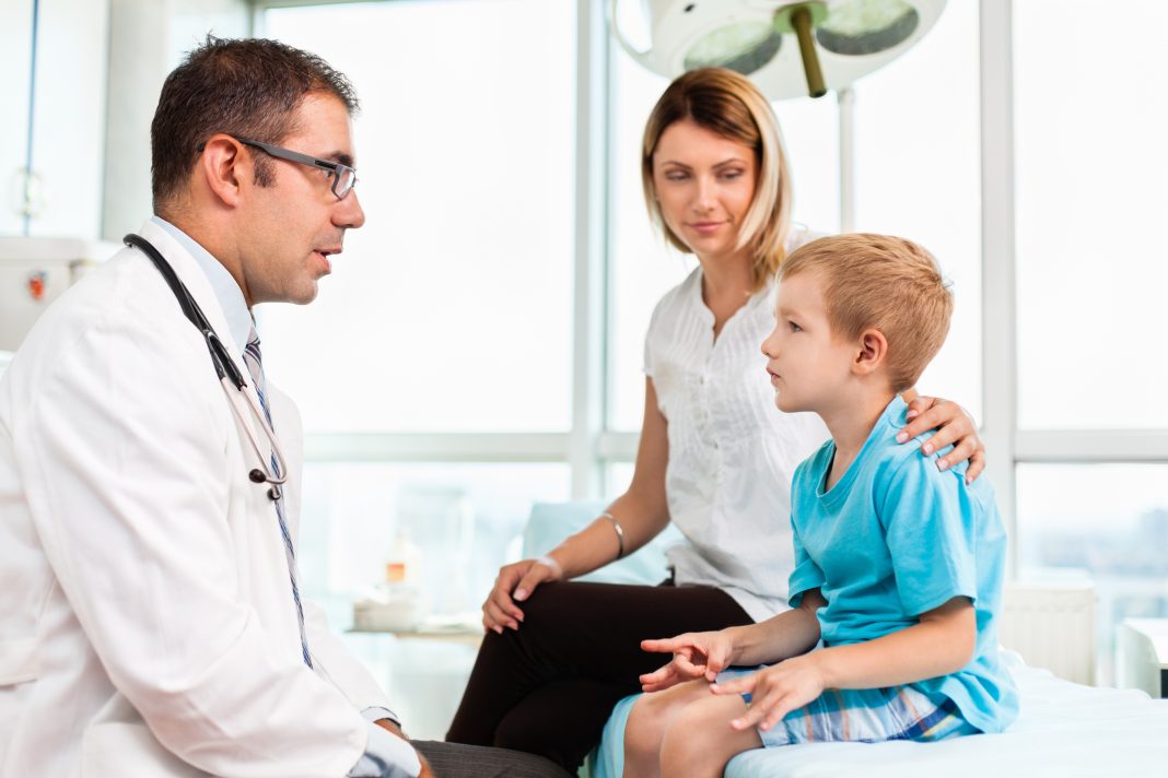 Mother and child in doctor's office stock photo