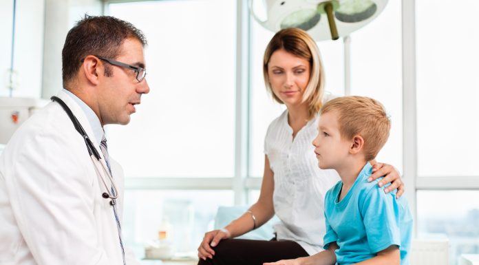 Mother and child in doctor's office stock photo