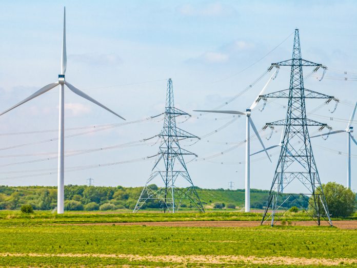 Electric high voltage tower with electric line near Keadby Power Station, England, UK