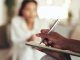 Hands, therapist and writing for counseling patient with depression, psychology assessment and medical report. Woman, psychologist and document for compliance questions, progress information and help