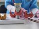 Doctor with human thyroid anatomy model. Thyroid tumor and cancer, postpartum period, papillary carcinoma and health
