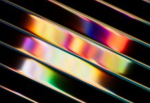 3d render, abstract background of diagonal glossy stripes. Vibrant wallpaper in neon multicolored rainbow shades - laser