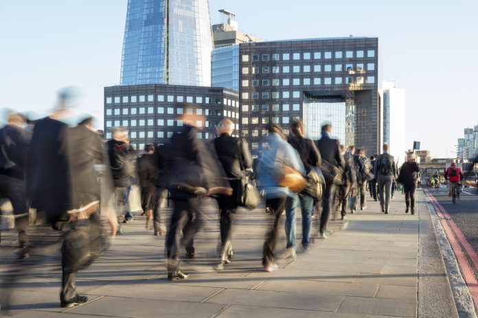 Large Group of Businesspeople Walking in London Financial District, Blurred Motion
