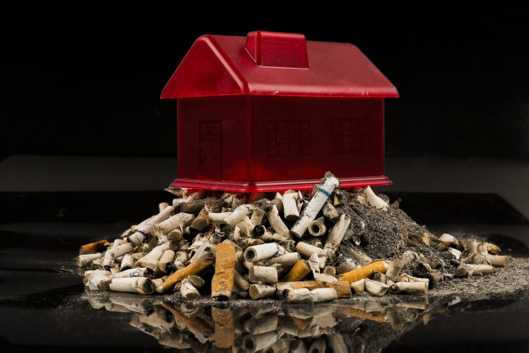 Cigarette butts under a home