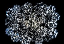 Close-up on a group of spherical nanoparticles, in glass material, with depth of field on black background
