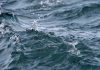Close up of wavy lake water with splash droplets - great lakes