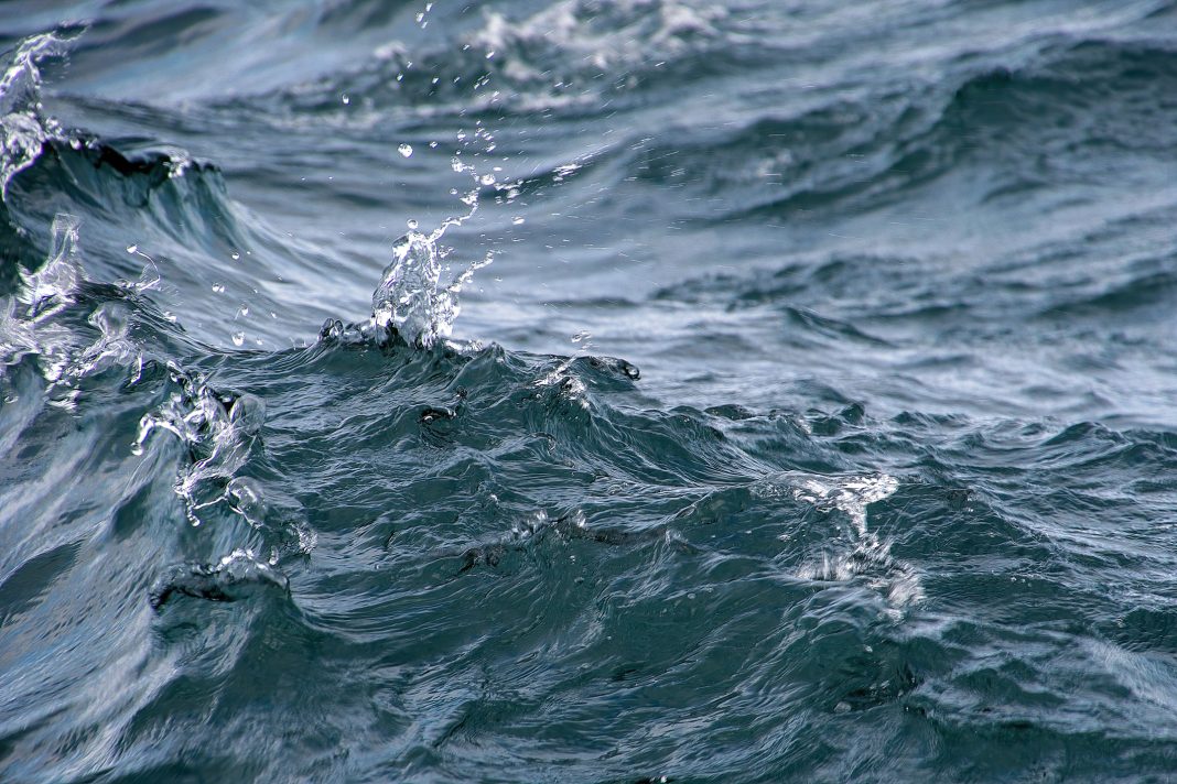 Close up of wavy lake water with splash droplets - great lakes
