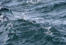 Close up of wavy lake water with splash droplets - great lakes