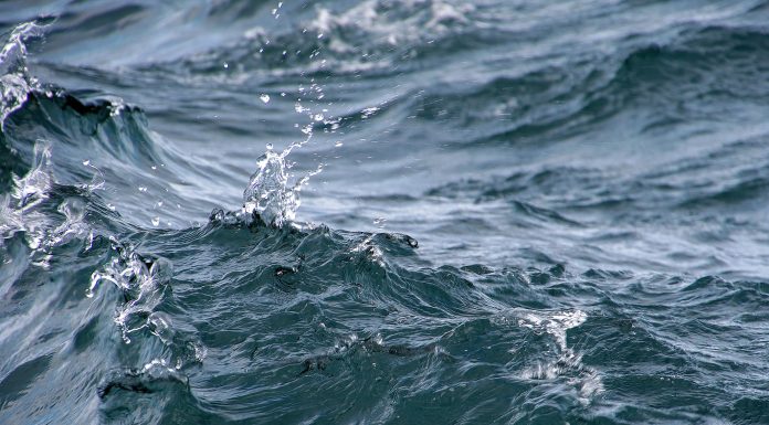 Close up of wavy lake water with splash droplets - great lakes