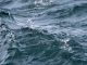 Close up of wavy lake water with splash droplets - great lakes