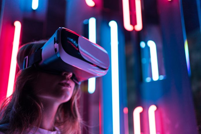 Vr headset. A woman looks around in virtual reality. Technological device for content consumption