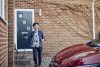This snapshot captures the profound impact of an individual's choices, depicting a woman charging her electric car at home, igniting a ripple of positive transformation.