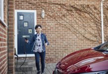 This snapshot captures the profound impact of an individual's choices, depicting a woman charging her electric car at home, igniting a ripple of positive transformation.