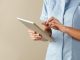 UK nurse using computer tablet browsing the internet