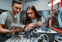 Engineering Students Learning About Diagrams To Connect PLC Devices