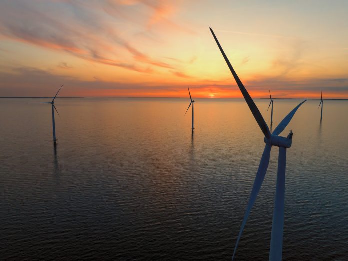 Wind turbines in the Noordoostpolder in Flevoland, The Netherlands, during springtime seen from above.