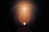 Lens flare on black background. Overlay design element